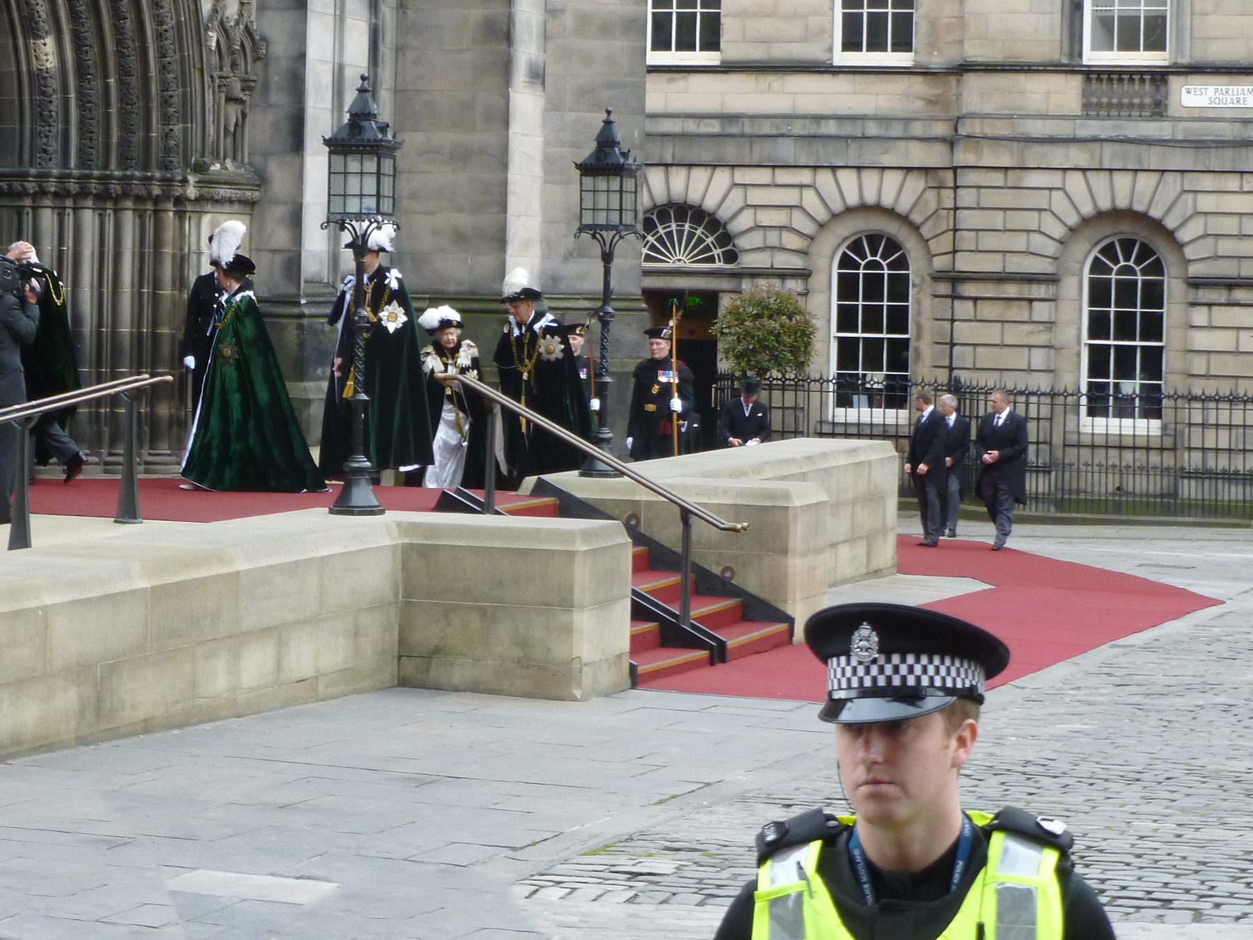 Queen Elizabeth II leaving a cathedral.