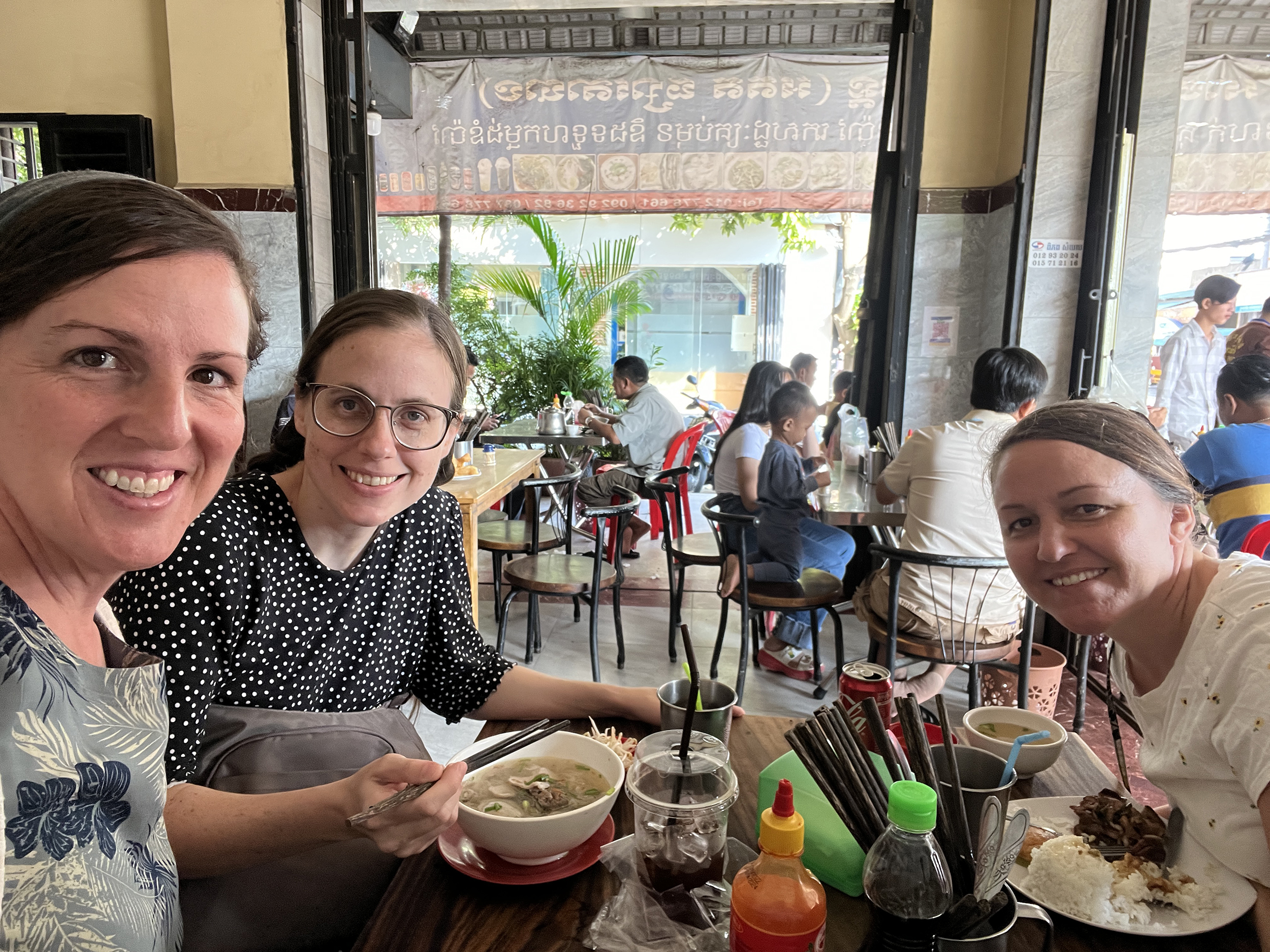 Three American women in Cambodia in a resturant