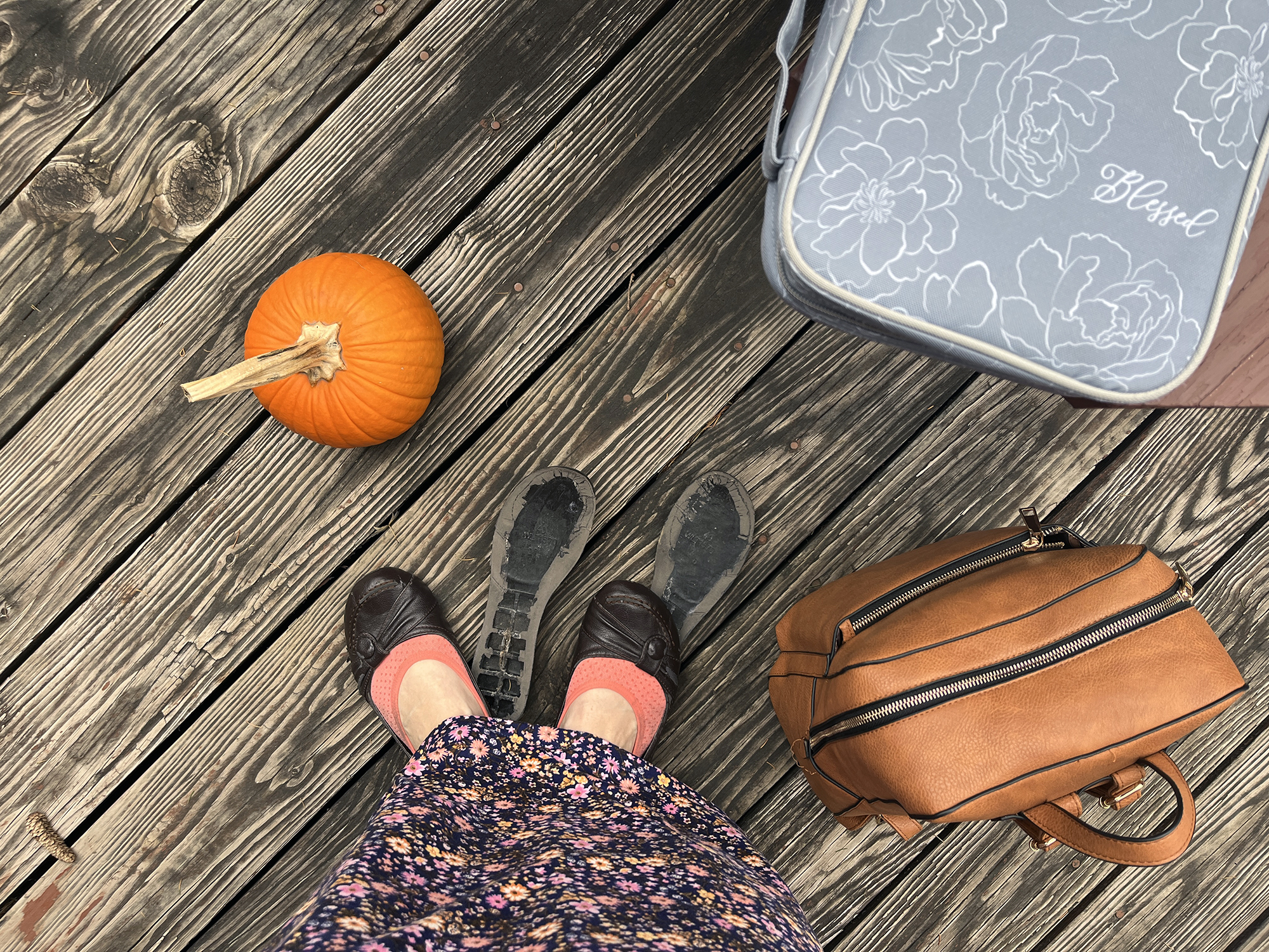 Shoes, backpack, and pumpkin on deck